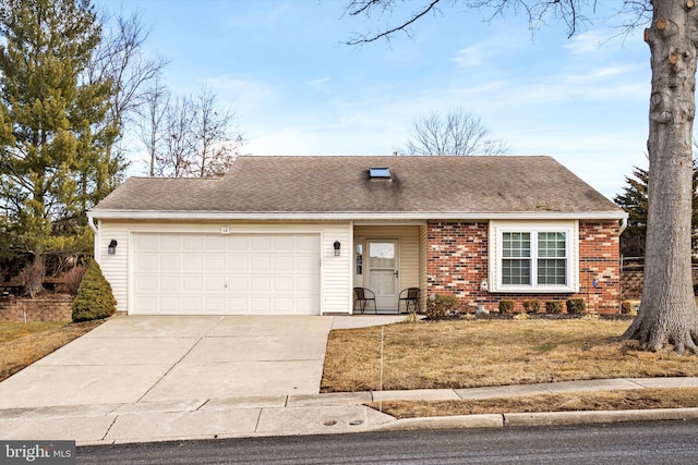 view of front of house with a garage and a front lawn