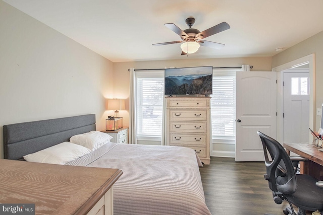 bedroom featuring ceiling fan and dark hardwood / wood-style flooring