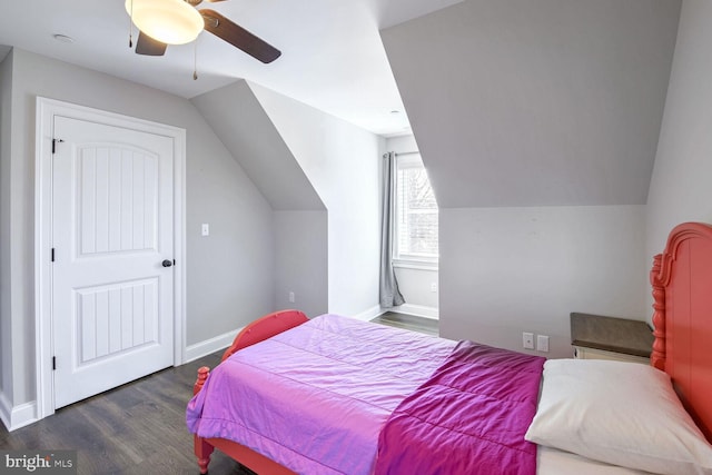 bedroom featuring dark wood-type flooring, ceiling fan, and lofted ceiling