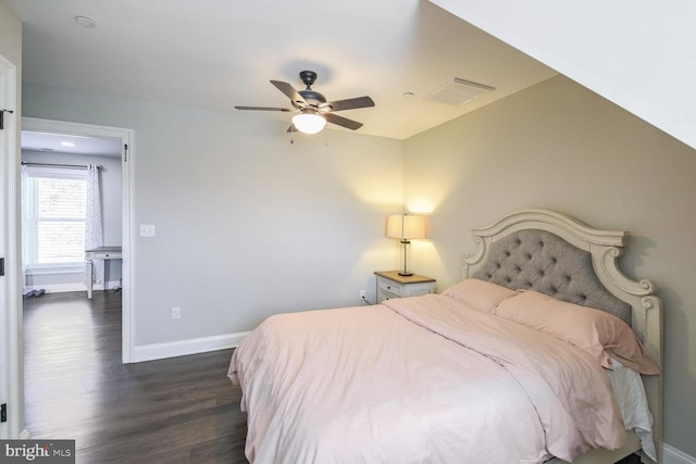 bedroom featuring ceiling fan and dark hardwood / wood-style floors