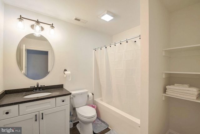 full bathroom with vanity, shower / bath combination with curtain, and toilet