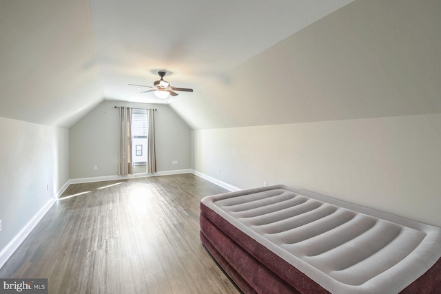 bonus room with hardwood / wood-style flooring, ceiling fan, and lofted ceiling