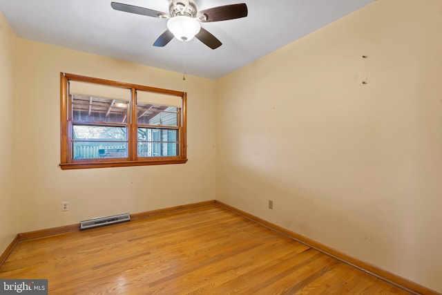 empty room featuring ceiling fan and light hardwood / wood-style floors