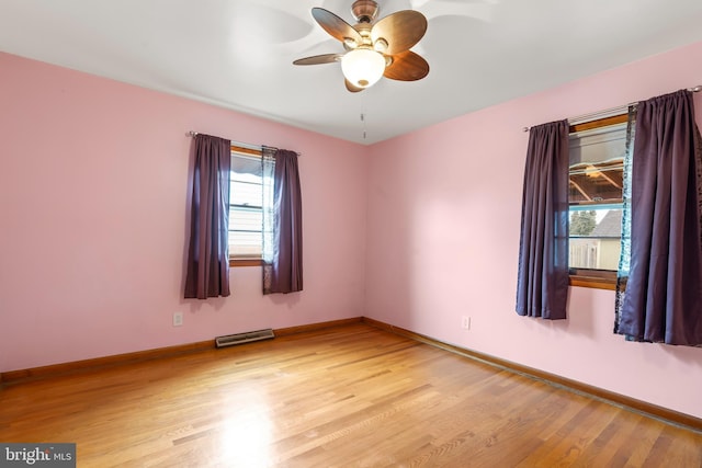 unfurnished room featuring ceiling fan and light wood-type flooring