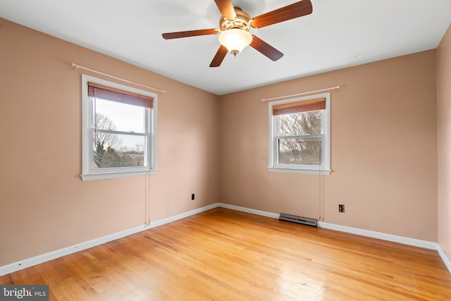 unfurnished room with light hardwood / wood-style flooring and ceiling fan