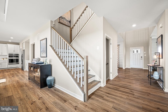 stairway featuring hardwood / wood-style flooring