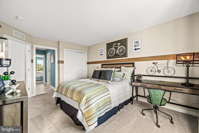 carpeted bedroom with a closet