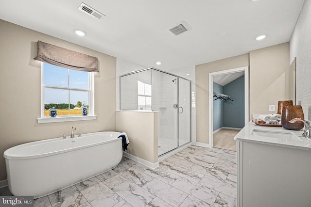 bathroom featuring independent shower and bath and vanity