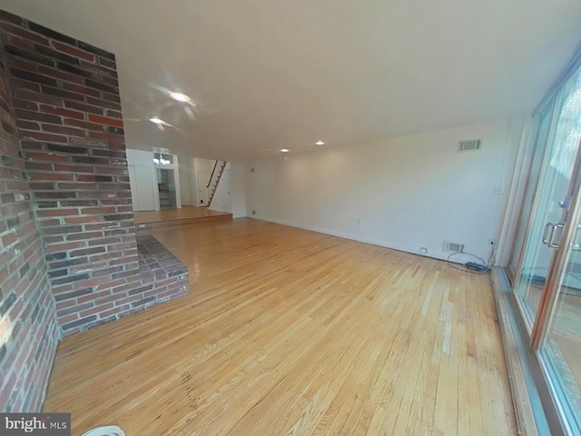 unfurnished living room with light hardwood / wood-style floors