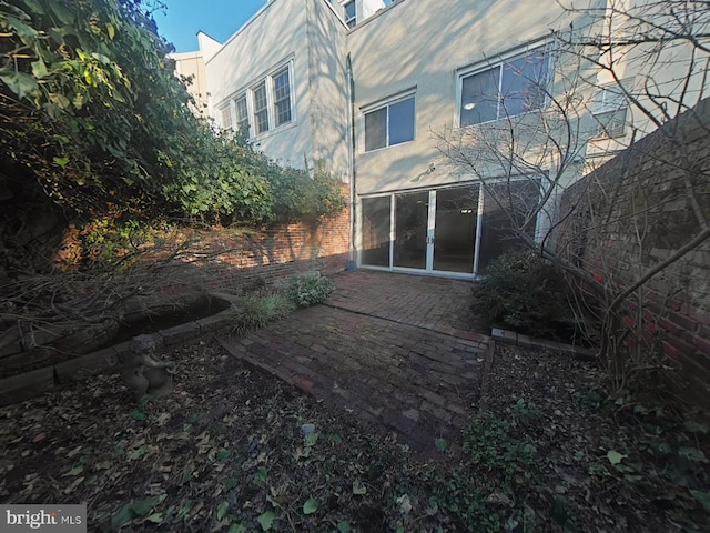 back of property featuring a patio area