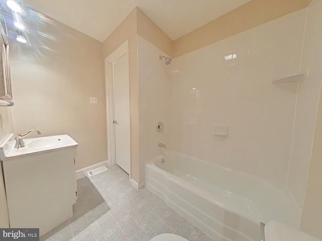 bathroom featuring vanity and tiled shower / bath combo