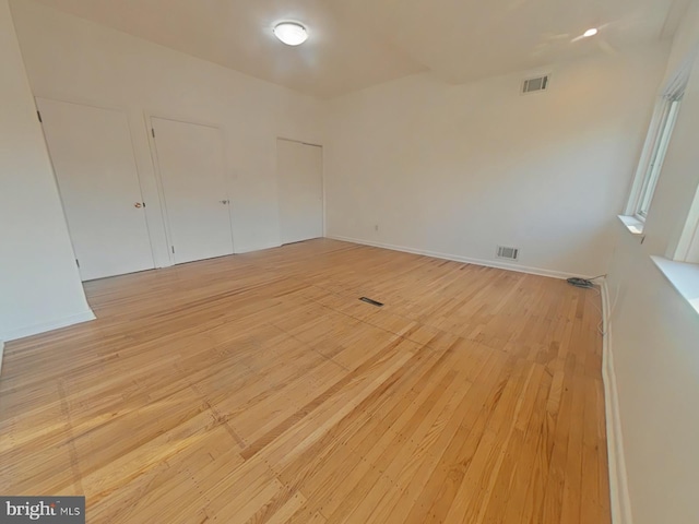 spare room featuring light hardwood / wood-style flooring