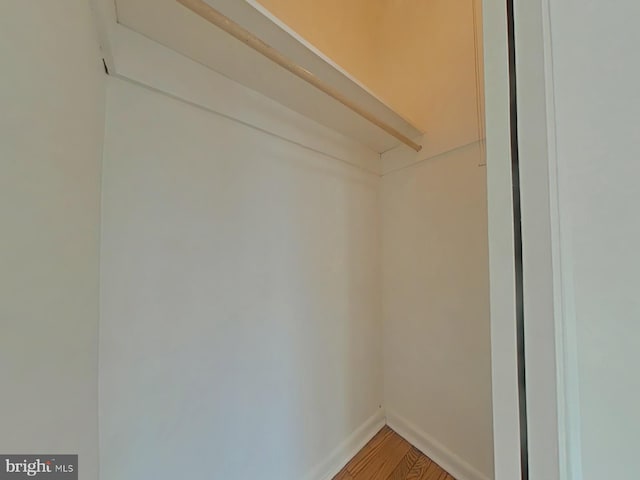 walk in closet featuring wood-type flooring