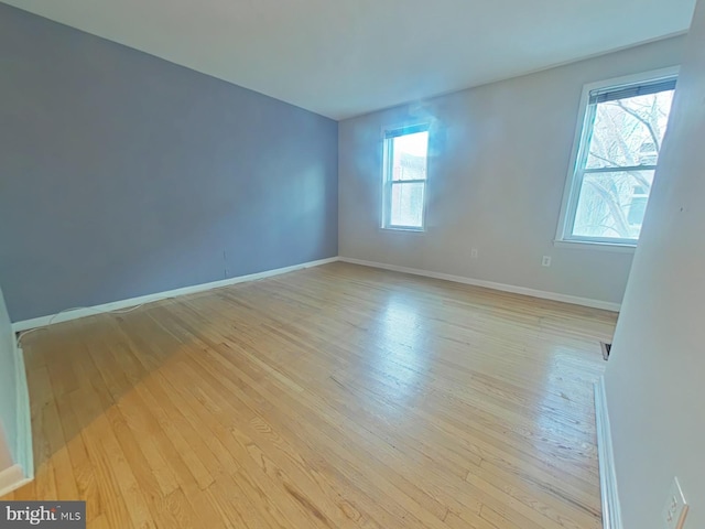 spare room with light wood-type flooring