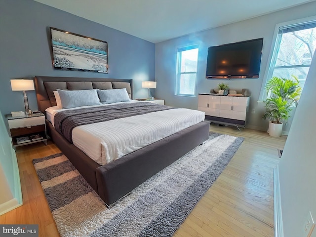 bedroom with light hardwood / wood-style floors