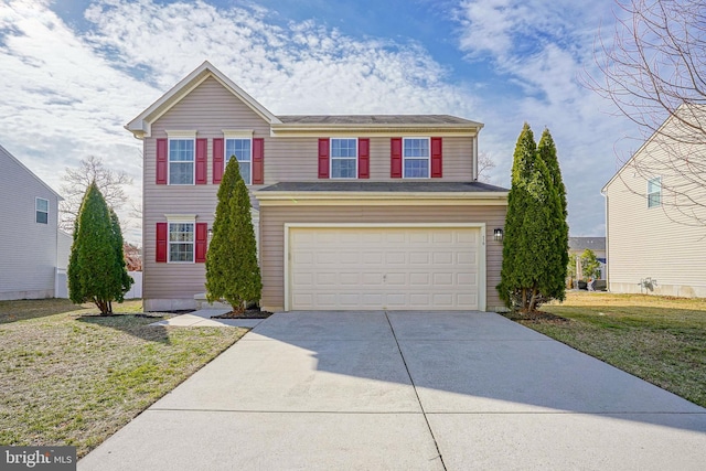 traditional-style house featuring a front lawn, an attached garage, and driveway