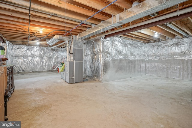 basement featuring heating unit