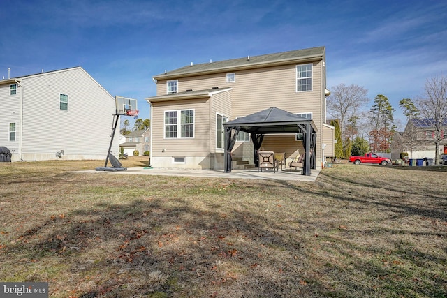 back of property with a gazebo, a yard, and a patio area