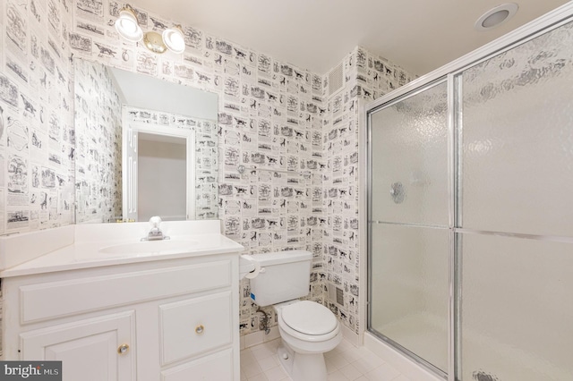 bathroom featuring a stall shower, wallpapered walls, toilet, tile patterned floors, and vanity