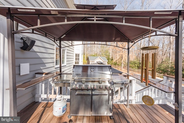 deck featuring a grill