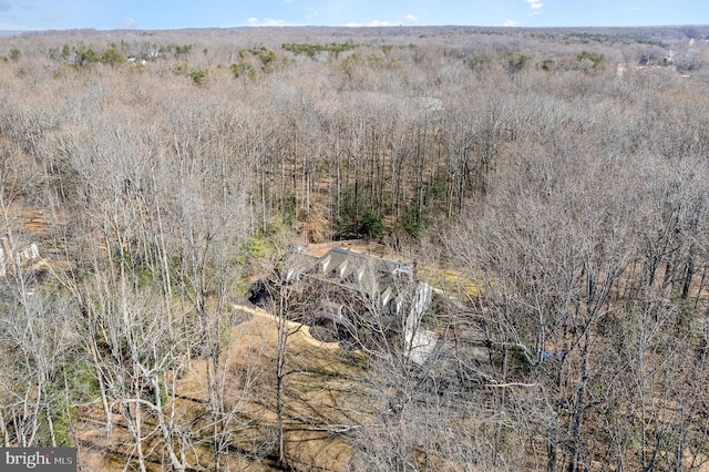 exterior space with a wooded view