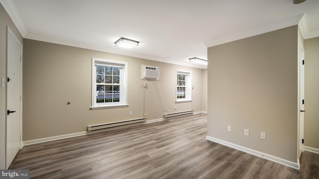 unfurnished room featuring crown molding, wood-type flooring, and baseboard heating