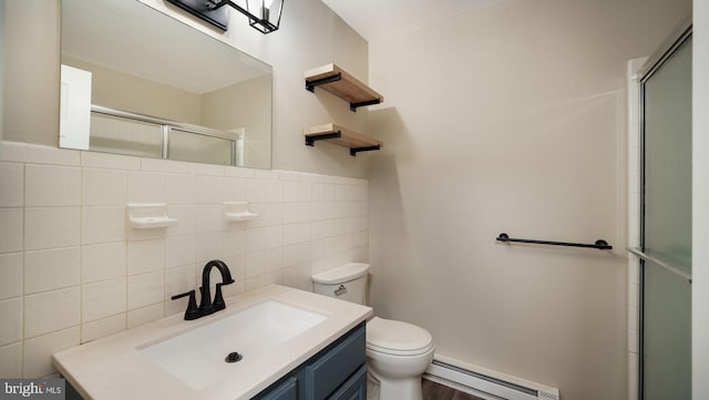 bathroom featuring walk in shower, toilet, tile walls, baseboard heating, and vanity