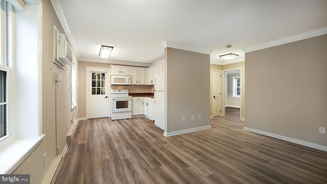 kitchen featuring white appliances, crown molding, tasteful backsplash, white cabinets, and dark hardwood / wood-style flooring