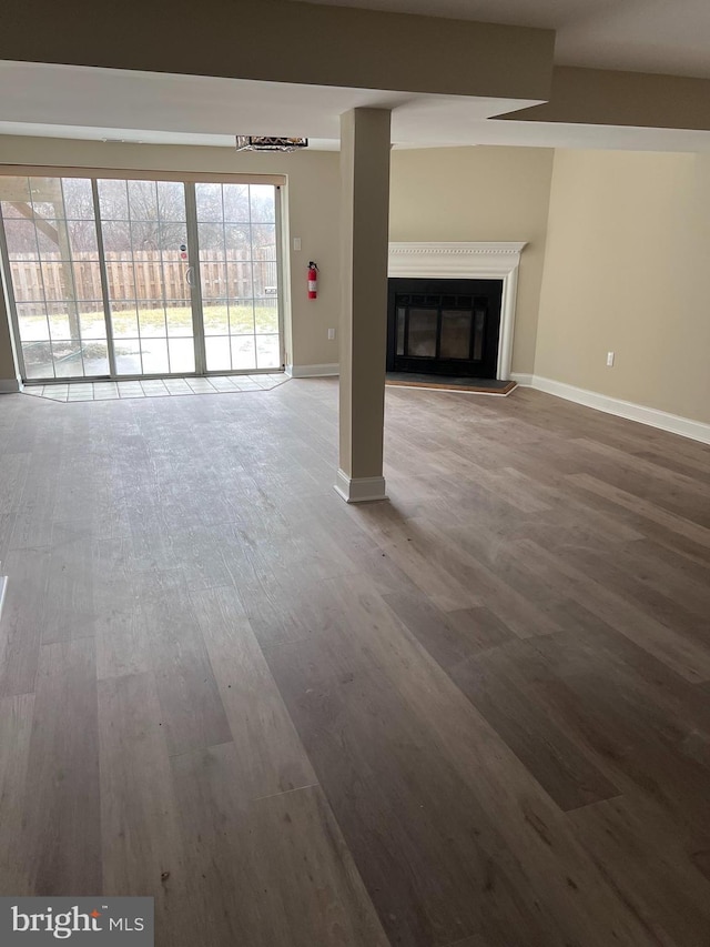 unfurnished living room featuring hardwood / wood-style floors