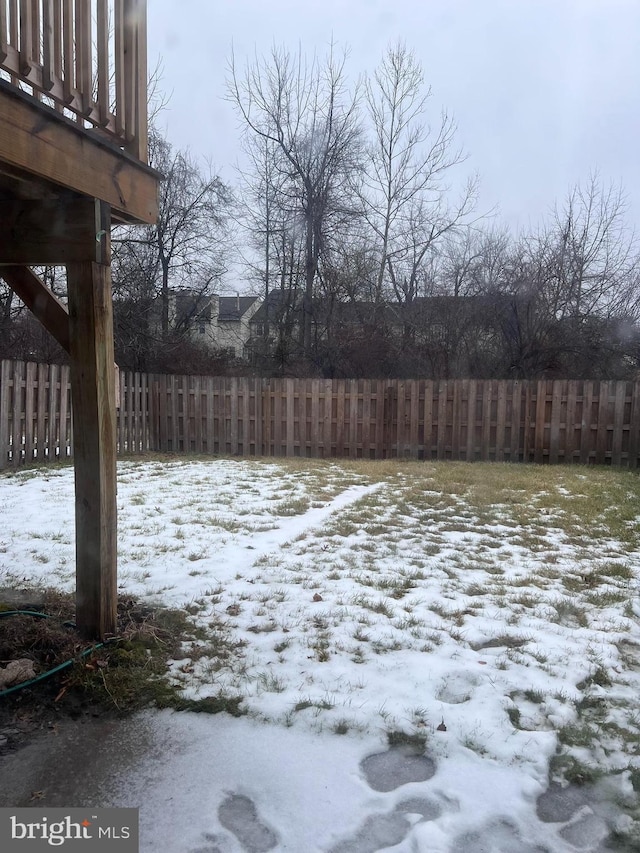 view of yard layered in snow