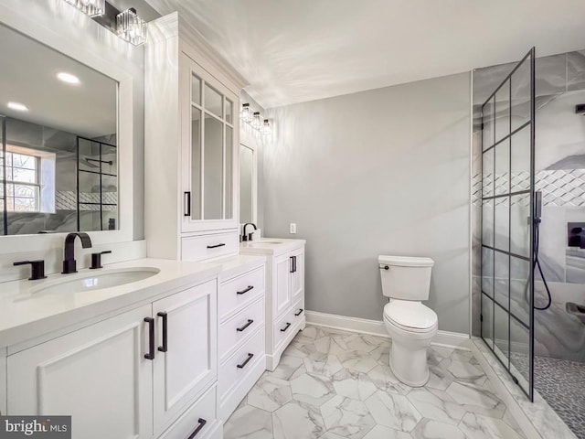 bathroom with vanity, an enclosed shower, and toilet