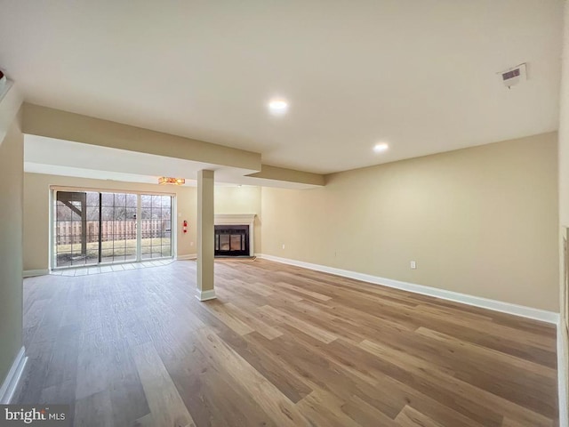 unfurnished living room with light wood-type flooring