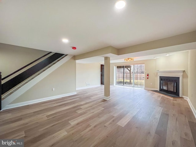 unfurnished living room featuring light wood-type flooring