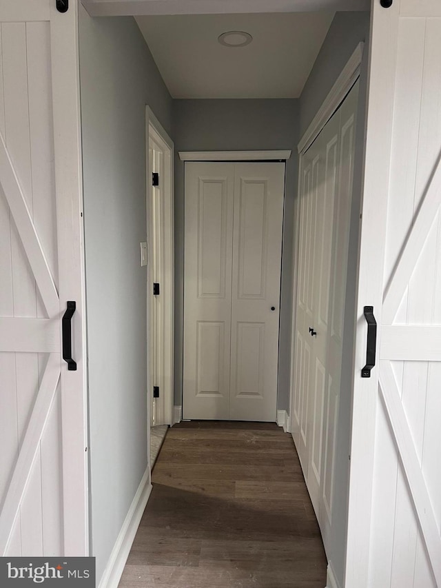 hallway featuring dark wood-type flooring