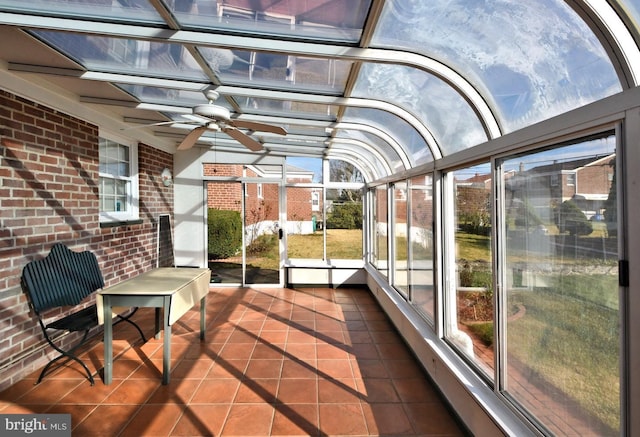 sunroom featuring ceiling fan