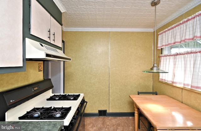 kitchen featuring gas stove and ornamental molding