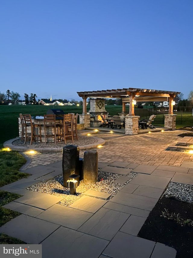 view of patio with fence, a pergola, and outdoor dry bar