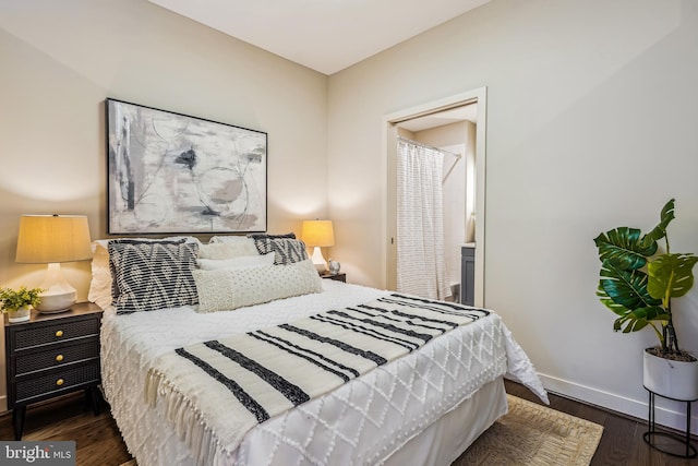 bedroom with dark hardwood / wood-style flooring