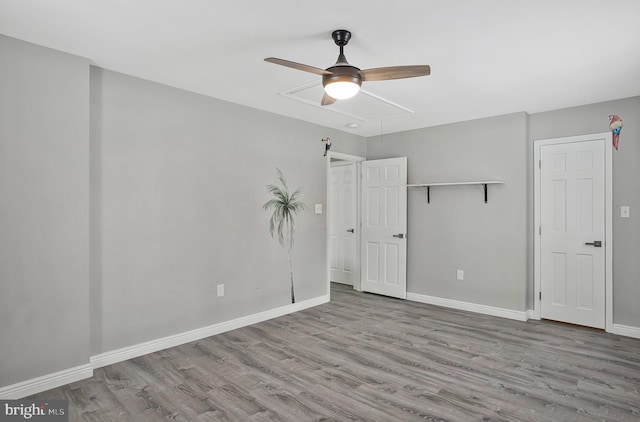 unfurnished bedroom featuring ceiling fan, light hardwood / wood-style floors, and a closet