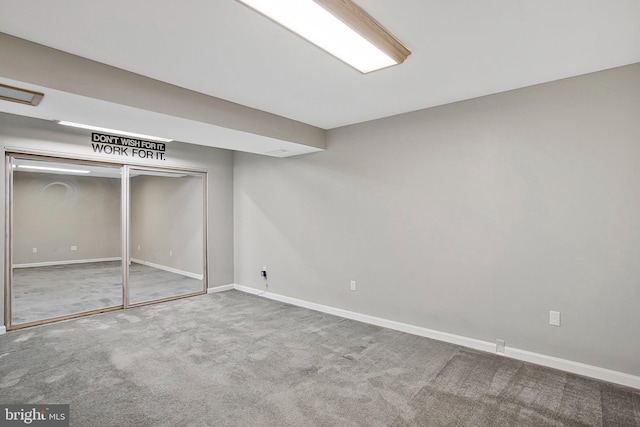 unfurnished bedroom with carpet flooring and a closet