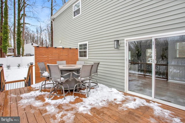 view of snow covered deck