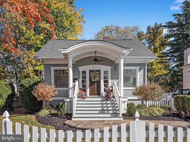 entrance to property with ceiling fan and covered porch