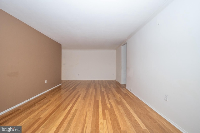 spare room featuring light wood-type flooring