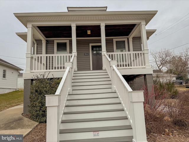 view of front of house featuring a porch and stairs