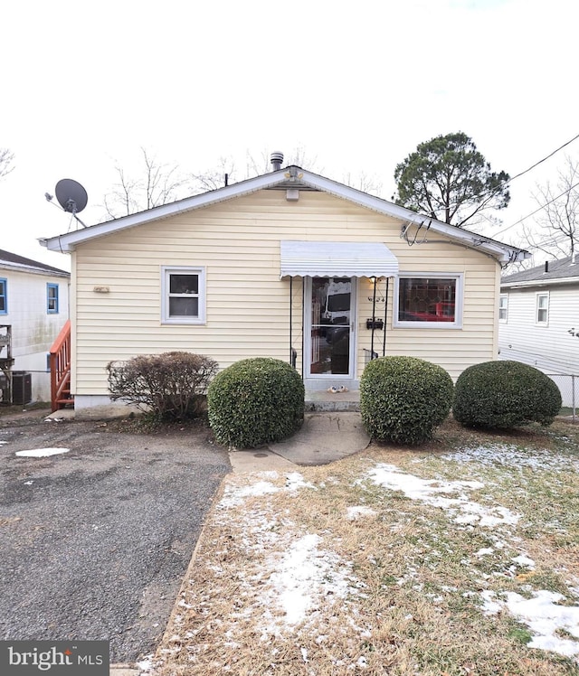 view of front of home featuring cooling unit