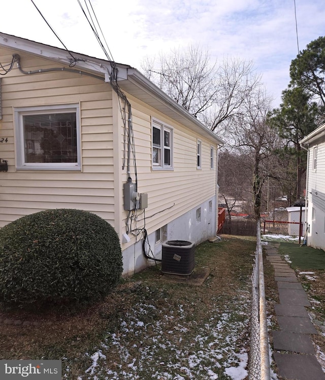 view of side of property featuring cooling unit