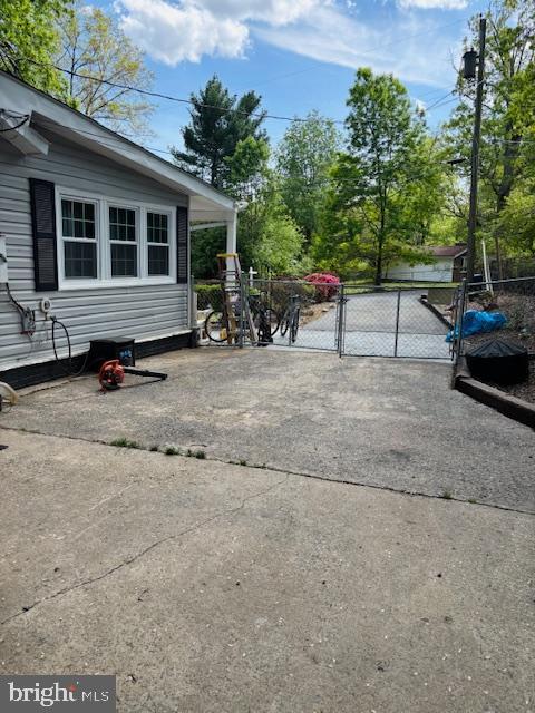view of patio with a gate
