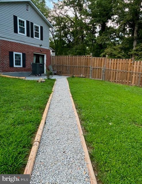 view of yard featuring central AC unit