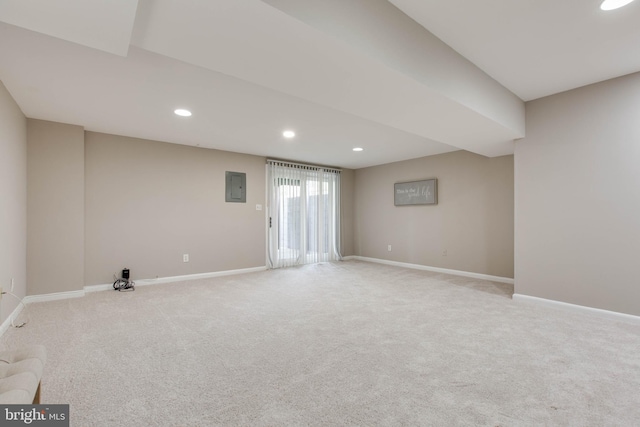 below grade area featuring recessed lighting, electric panel, carpet flooring, and baseboards