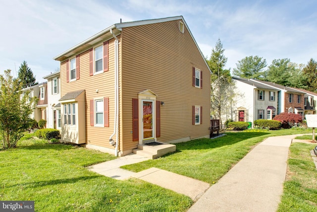 exterior space with a front yard and a residential view